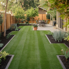 Neatly maintained backyard with green artificial grass - Tool Market