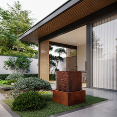Modern house exterior with a garden and decorative Mac Landscape's Davy water fountain