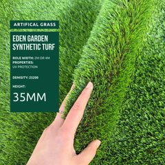 Artificial grass with a hand pointing to its texture, featuring Eden Garden Synthetic Turf 