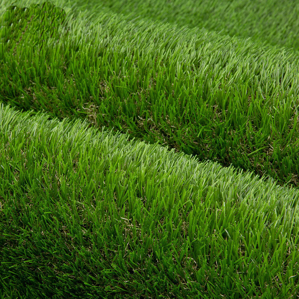 Close-up of artificial grass with a roll in the background