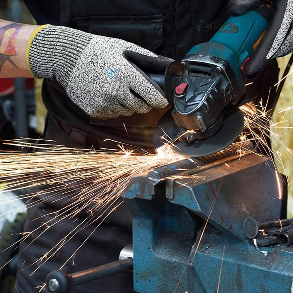 Person using a angle grinder with sparks flying, wearing protective gloves.